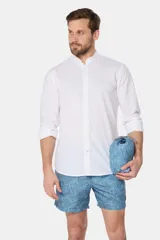 Short de baño azul con estampado de hojas, cintura elástica con cordón ajustable, bolsillos laterales y suspensor de malla fina.