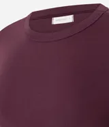 Blusa básica ajustada en rib de algodón, de manga corta y cuello redondo, color mostaza.