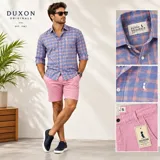 Camisa de manga larga Duxon Originals con cuello italiano, diseño a cuadros grandes en tonos celeste y rosa, y bordado sutil en el pecho.