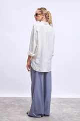 Pantalón palazzo azul con cintura elastizada y cordón ajustable.