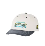 Gorra con visera curva de Rip Curl, modelo Bells Pro, color beige con visera y detalles en gris oscuro. Cuenta con bordado frontal alusivo al evento de surf de Bells Beach, Australia, y diseño de campana bordada en el lateral.