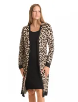 Vestido de tejido de punto marca Nina Leonard, con diseño Twofold que simula un conjunto de vestido negro liso y cárdigan largo con estampado geométrico blanco y negro. Presenta escote redondo y manga larga de corte recto.