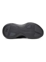 Championes Under Armour UA Echo de color negro, con diseño deportivo, amortiguación UA HOVR y sistema de cordones asimétricos con cierre rápido. Cuentan con parte superior translúcida multicapa, talón convertible UA SlipSpeed y suela de goma.