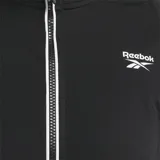 Campera deportiva Reebok Identity para mujer, color negro, con cierre frontal y cuello alto. Presenta ribetes blancos a lo largo de la cremallera y el dobladillo, y un logo Vector grande en la espalda.