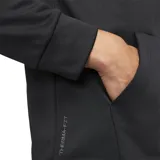 Campera con capucha y cierre completo Nike Therma-FIT para hombre, color negro con logo blanco bordado en el pecho. Fabricada con tejido suave en capas y al menos un 75 % de fibras de poliéster recicladas.