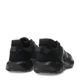 Championes de running New Balance modelo Nitrel, color negro, con diseño de malla transpirable y refuerzos sintéticos en la puntera y laterales. Presenta el logo N característico en el lateral y suela con tecnología AT Tread para mayor tracción.