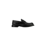 Mocasines Bottega Veneta modelo James, confeccionados en cuero negro con diseño trenzado característico de la marca (Intrecciato), suela baja y taco sutil.