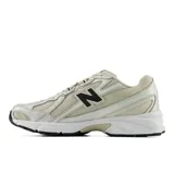 Championes New Balance modelo 740, de diseño inspirado en el running de los años 2000. Presenta una parte superior de malla en tono beige con superposiciones sintéticas angulares, logotipo N lateral en color negro y entresuela blanca con tecnología ABZORB para amortiguación.