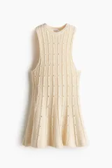 Top de punto pointelle H&M Edition, color beige, sin mangas, con cuello redondo y diseño acampanado con peplum.