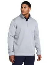 Buzo deportivo Under Armour Storm SweaterFleece de color gris, con cuello alto, cierre frontal parcial de un cuarto y mangas largas.