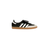 Championes Adidas Samba LT, modelo para mujer, en color negro con franjas blancas y suela de goma tipo tómbola. Cuenta con lengüeta rebatible característica y detalles en cuero.