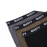 Pack de tres boxers de la marca Rusty, en colores negro, gris y verde militar, con cintura elástica ancha en color negro y logo impreso en blanco.