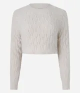 Suéter cropped de chenille color crema, con cuello redondo y mangas largas.