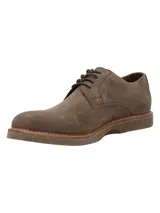 Zapato casual de cuero para hombre en color marrón, con cordones, punta redonda y suela de goma con textura.