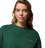 Buzo de cuello redondo color verde bosque, con corte oversize y logo de la marca bordado en el pecho. Presenta puños y dobladillo acanalados.