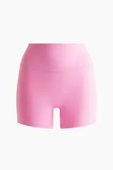 Bikers deportivas de tiro alto en color rosado, confeccionadas con tejido funcional SculptMove que realza la silueta y ofrece sujeción. Cuentan con cintura ancha y tecnología DryMove para absorber el sudor.