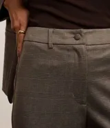 Pantalón de vestir de punto roma con estampado de cuadros príncipe de gales, corte recto y cintura baja.