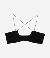 Soutien tipo bralette confeccionado en tule, con diseño de escote profundo, breteles finos y sin copa. Presenta un recorte central y una estructura ligera que se ajusta al cuerpo.