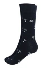 Par de medias de vestir azul marino con estampado de palmeras blancas.