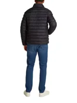 Campera puffer negra Tommy Hilfiger, con cuello alto, cierre frontal con cremallera, bolsillos laterales y logo bordado en el pecho.