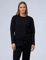 Buzo negro de jersey, marca Nanette, con cuello redondo y mangas largas. Presenta pinzas en los hombros.