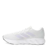 Championes deportivos Adidas modelo Switch Move, color blanco con las icónicas tres tiras en tono lila suave y detalles en amarillo neón en la lengüeta. Presentan una suela de espuma blanca con base negra y un diseño de malla transpirable.