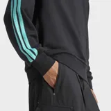 Buzo de cuello redondo Adidas, parte de la colección Mercedes-AMG Petronas F1 Team. Es de color negro con detalles en color turquesa en las mangas, presentando las icónicas tres rayas de la marca. Incluye el logo de Adidas y el emblema de Mercedes-AMG Petronas en el pecho.