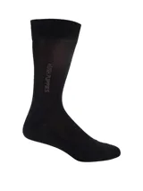 Medias de largo medio Hush Puppies, color negro, con logo de la marca estampado verticalmente en el lateral.