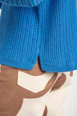 Sweater celeste de tejido de punto calado con lurex, de corte holgado y mangas largas.