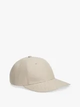 Gorra de béisbol Tommy Hilfiger color beige con diseño de seis paneles y patrón integral de monogramas en jacquard.