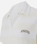 Remera polo deportiva de manga corta, confeccionada en tejido piquet con textura. Presenta un diseño a rayas horizontales en tonos crema y blanco, con cuello tipo polo y bordado con la palabra 'Athletics' en el pecho.