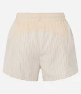 Short deportivo femenino tipo runner de la marca Get Over, color beige, confeccionado en poliamida con cintura elástica, cordón de ajuste y recortes con hilo reflectante.