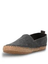 Alpargatas Hush Puppies modelo Hubert, color negro, con suela de yute trenzado y costuras decorativas. Diseño slip-on con elástico en el empeine.