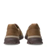 Zapatos tipo slip-on Caterpillar confeccionados en lona color beige, con suela de goma robusta en tono marrón y detalle de logo en el lateral.