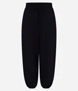 Pantalón de mujer color marrón oscuro, estilo balloon o bombacho, con cintura y puños elásticos.