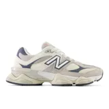 Championes New Balance 9060 unisex color crema con detalles en gris y azul.