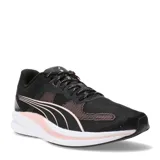 Championes deportivos Puma modelo Redeem Profoam, color negro con detalles en rosado y suela blanca. Presentan diseño de malla transpirable y cierre con cordones.