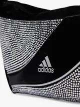 Bolso de hombro Adidas de diseño curvo, color negro, decorado con aplicaciones de pedrería brillante en los laterales y logo de la marca estampado en el centro.