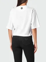 Camiseta corta blanca de algodón con cuello redondo y mangas cortas. Presenta un estampado frontal de un oso de peluche con strass y el logo de la marca Philipp Plein.