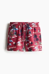 Short de baño con estampado tropical, cintura elástica con cordón ajustable, bolsillos laterales, bolsillo trasero con cierre y suspensor interior de malla.