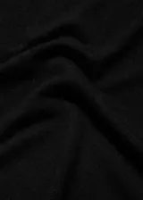 Buzo de punto fino con cuello redondo y manga larga, de diseño recto y corte clásico.