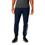 Pantalón tipo jogger de color azul marino, con ajuste elástico en los tobillos y logo de la marca estampado en vertical sobre la pierna izquierda.