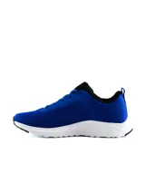 Championes Umbro modelo Volten para hombre, de color negro con suela blanca y el logo de la marca en el lateral.
