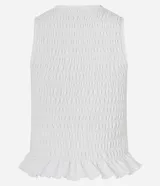 Musculosa blanca con cuello redondo, diseño con lastex y volado en el bajo.