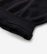 Buzo negro de algodón con felpa, corte boxy, cuello alto con cremallera, mangas largas con puños ajustados y bordado con la frase "Join the hype".