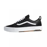 Championes Vans modelo Skate Old Skool con tecnología Wafflecup, color negro con detalles en blanco. Presentan una combinación de materiales en la capellada, cordones blancos, la icónica banda lateral de Vans y una suela de goma resistente con diseño de waffle.