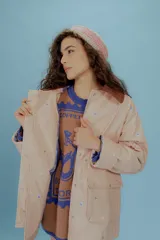 Campera reversible con tela a prueba de agua, talle único oversized hasta 110 cm de busto.