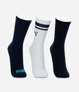 Kit de tres pares de medias deportivas Puma de caña larga, confeccionadas en algodón. Incluye un par blanco con rayas y logo azules, un par negro con rayas y logo blancos, y un par liso de color azul.