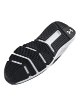 Championes de entrenamiento Under Armour modelo Charged Commit TR 4, color negro con entresuela blanca. Presentan parte superior de malla ligera con detalles texturizados, plantilla Deluxe Comfort System y mediasuela Charged Cushioning para mayor amortiguación y respuesta.