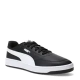 Championes urbanos Puma modelo Court Classic Clean, color negro con detalles en blanco. Presentan el logo de la marca en el lateral y en la lengüeta, con suela de goma blanca y diseño de inspiración tenística.